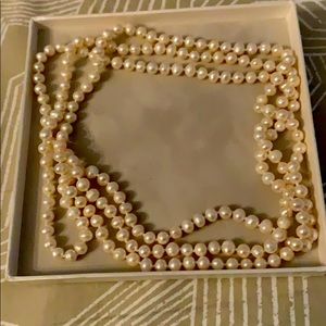 Long white pearl necklace